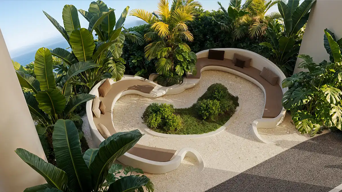 A cozy sunken garden lounge enveloped by lush tropical greenery and soft natural light.