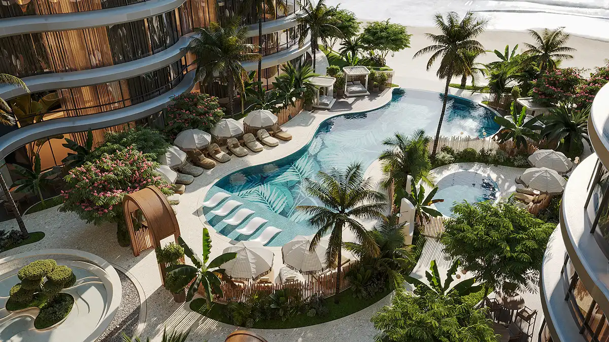 A resort-style pool deck with cabanas, sun loungers, and lush landscaping overlooking the beach.