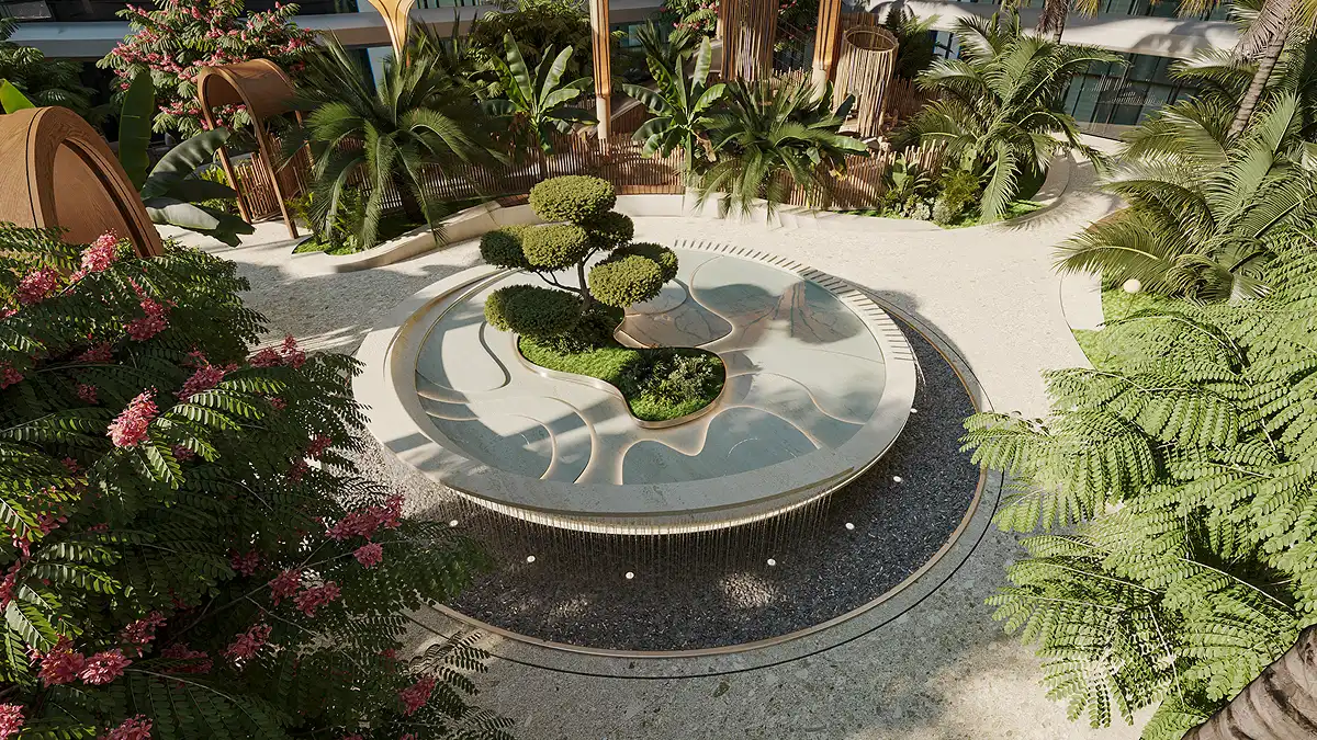 A sculptural water feature blending organic shapes, greenery, and tranquil flowing water.