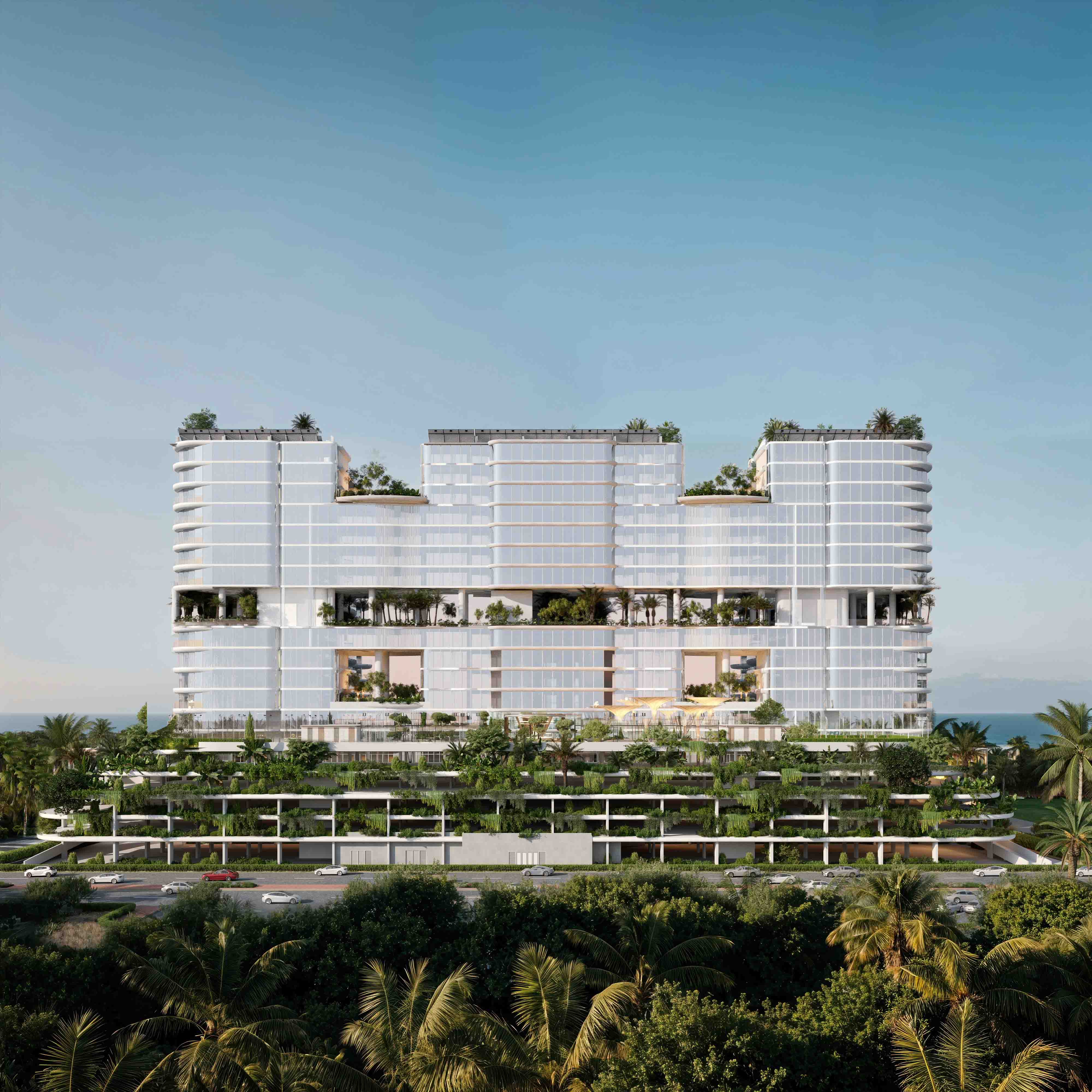 Front elevation of AMRA’s glass façade with suspended sky gardens and layered green terraces.