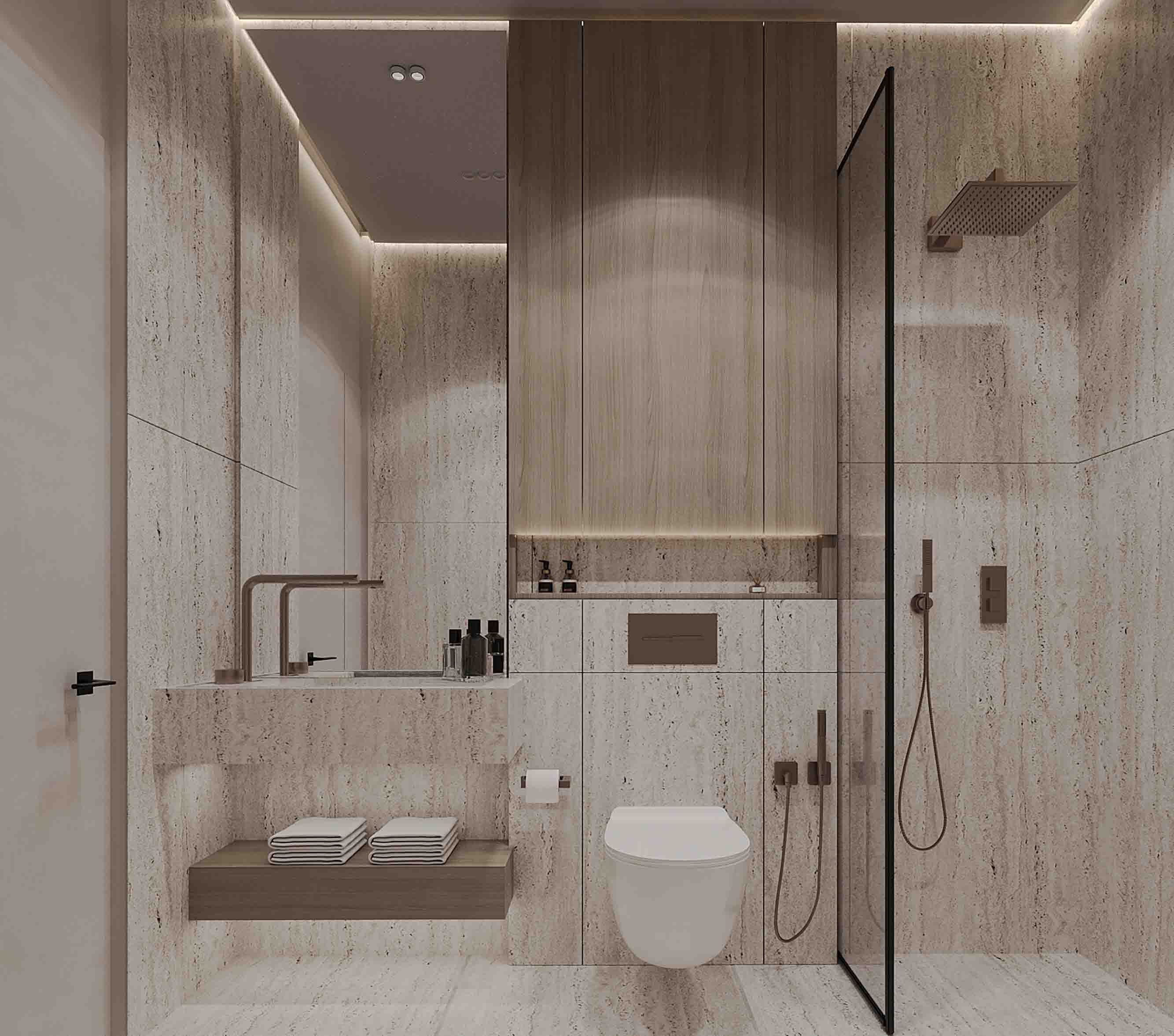 Refined bathroom with warm lighting, stone-clad walls and glass-enclosed rain shower.