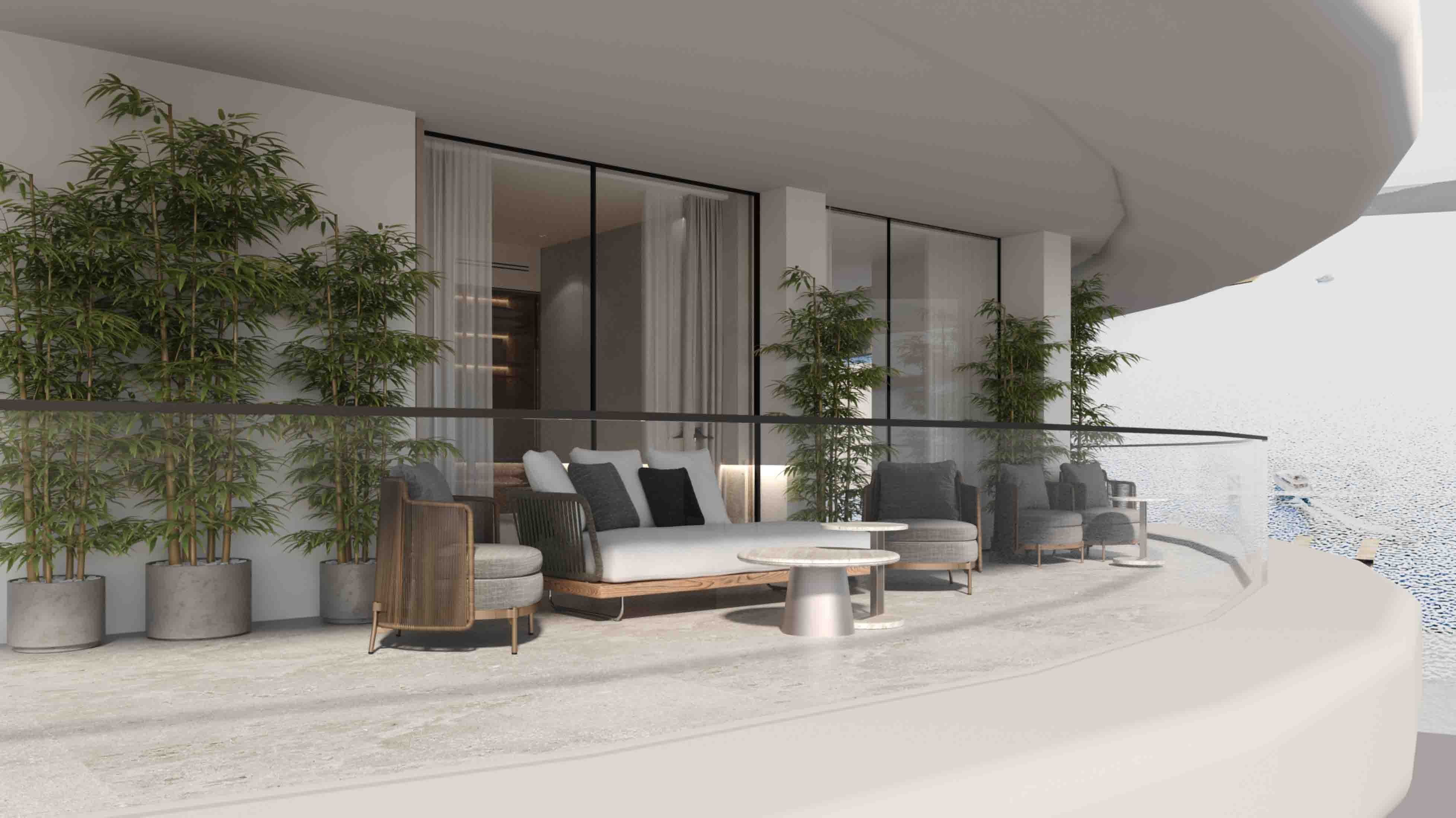 Spacious curved terrace with lush potted bamboo, lounge seating and glass balustrade overlooking the sea.